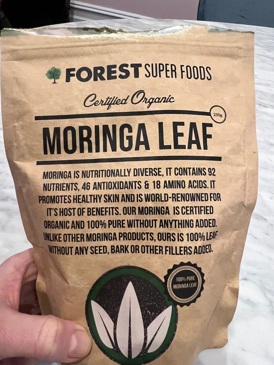 Bag of Forest Super Foods Certified Organic Moringa Leaf powder, highlighting moringa powder benefits with 92 nutrients, 46 antioxidants, and 18 amino acids that promote energy, digestion, and overall wellness.